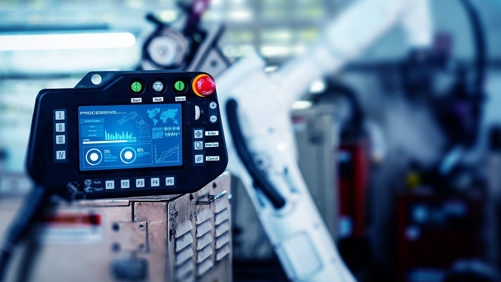 Robot teach pendant showing a control screen beside a robotic arm on a factory line