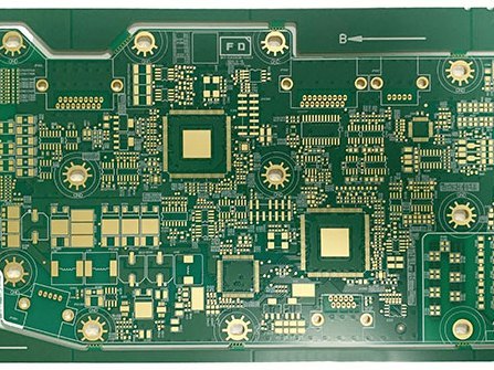 Multi-layer printed circuit board with plated through holes on a white background